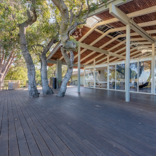 Covered deck area with trees